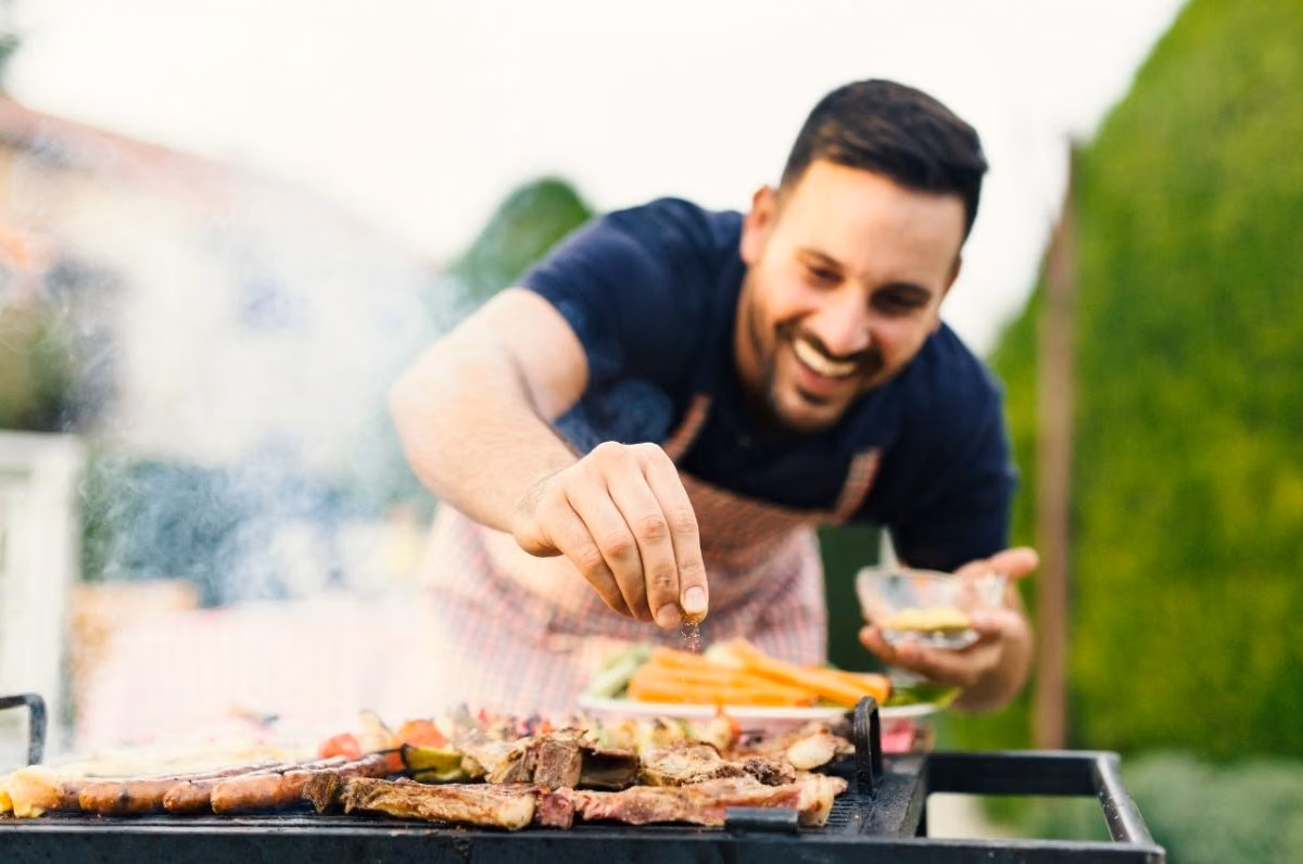 man grilling