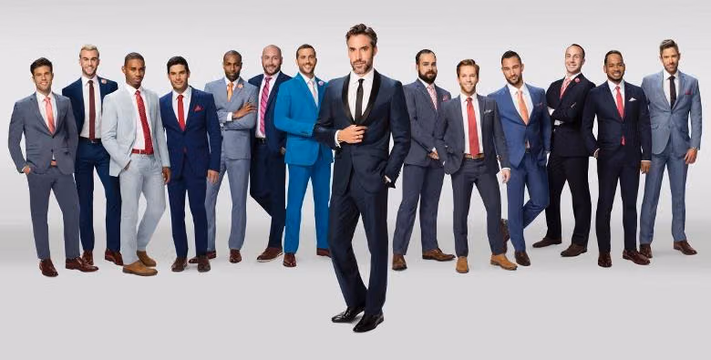 Finding Prince Charming bachelor Robert Sepulveda Jr in a tuxedo, flanked by suitors in colorful suits