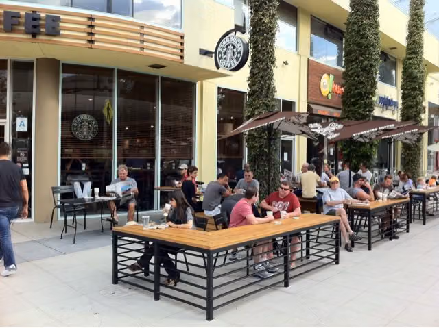 Crowded outdoor patio tables at a Starbucks in West Hollywood