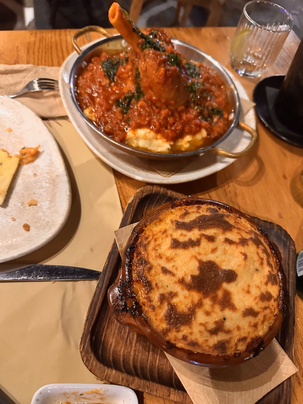 Moussaka and lamb shank on our waterfront table at Pelican Restaurant.