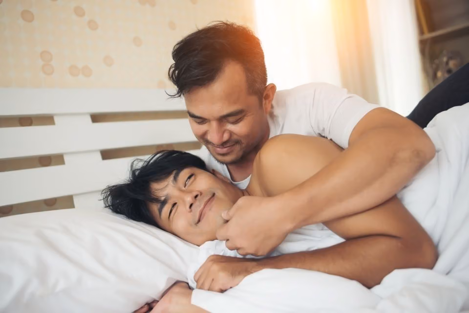 gay asian couple in bed