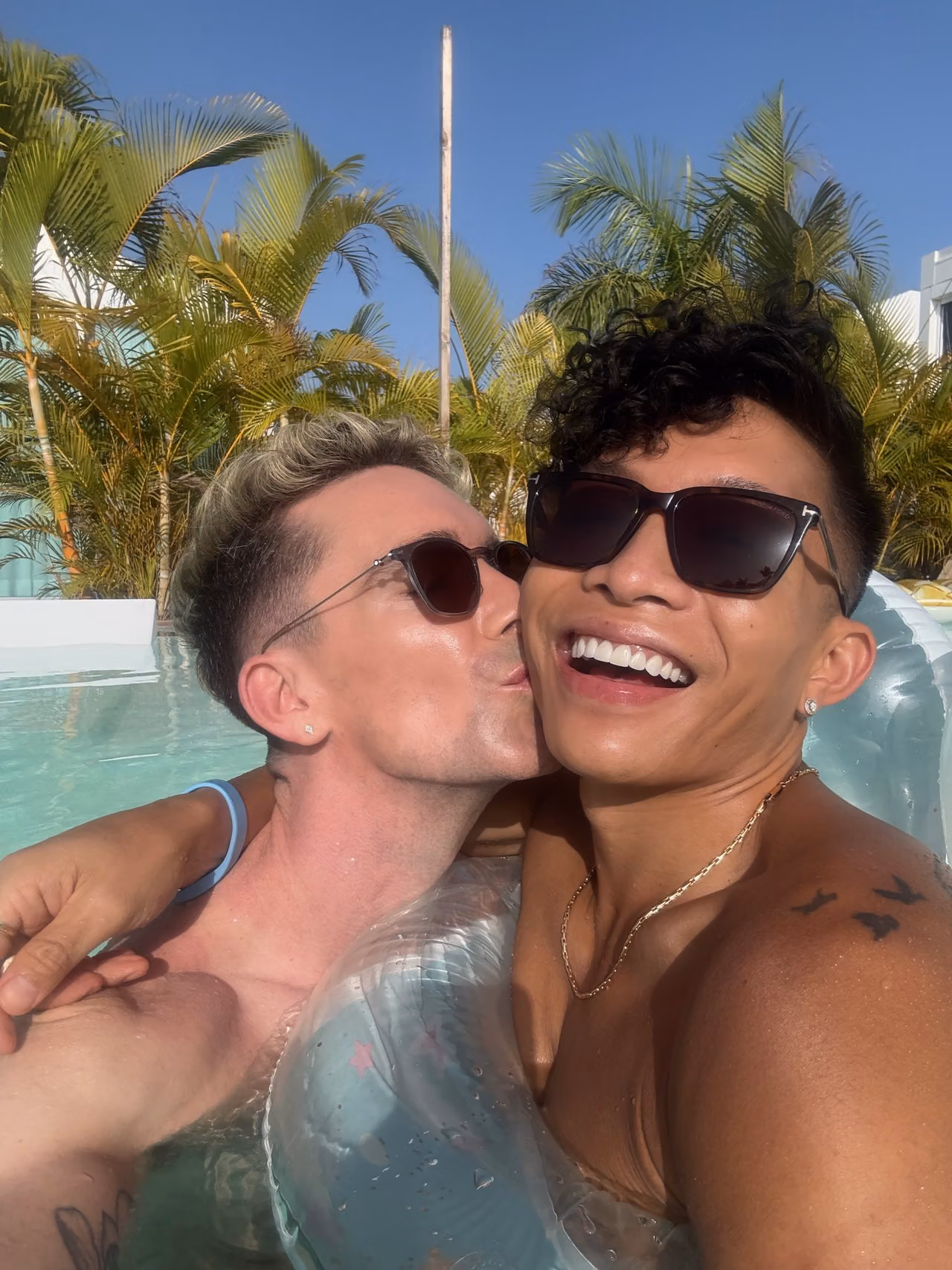 Mark and Beatus sharing a kiss in the pool at Seven Hotel & Wellness.