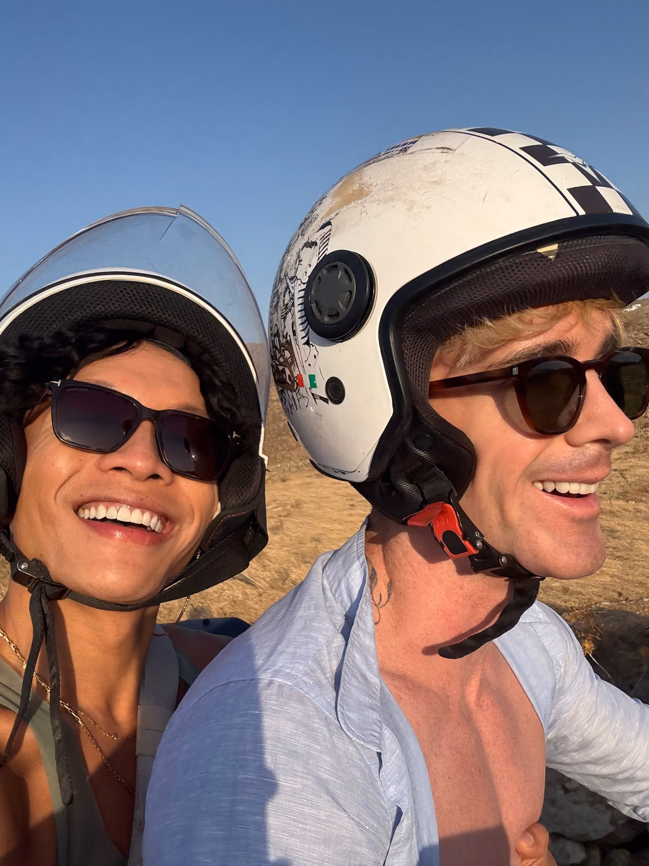 Mark and Beatus wearing helmets for an ATV ride in Mykonos.