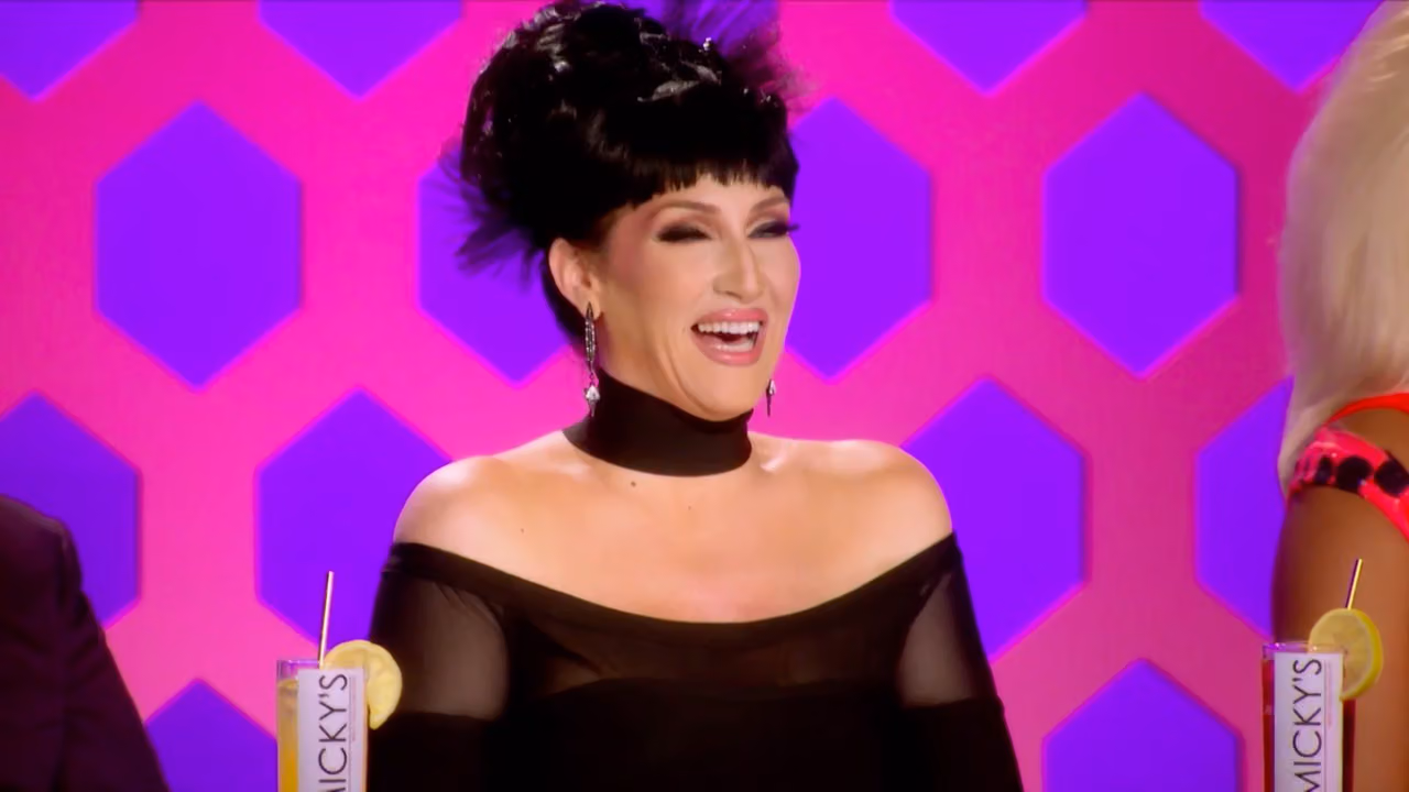 Michelle Visage laughing at the judges' table, the guest of honor for the RuPaul Roast