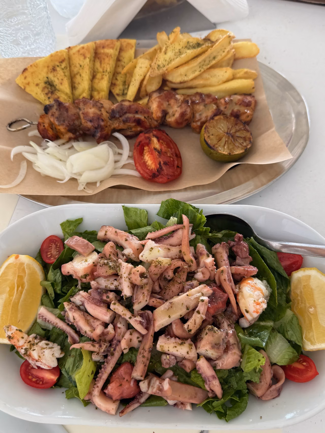 Souvlaki and seafood salad on our lunch table at Lalamou.