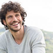 curly hair man smiling