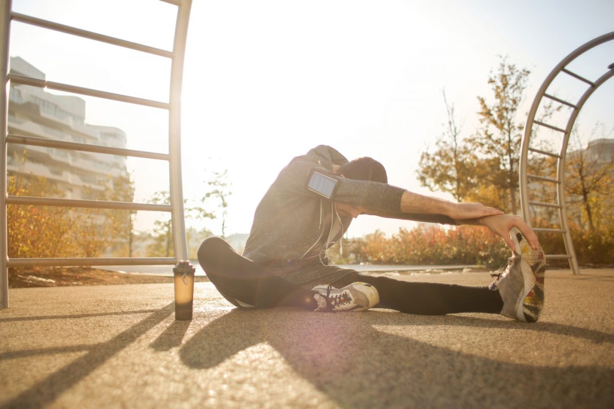 https://www.theauthenticgay.com/wp-content/uploads/2020/06/flexible-sportsman-stretching-on-sports-ground-3771071-scaled.jpg