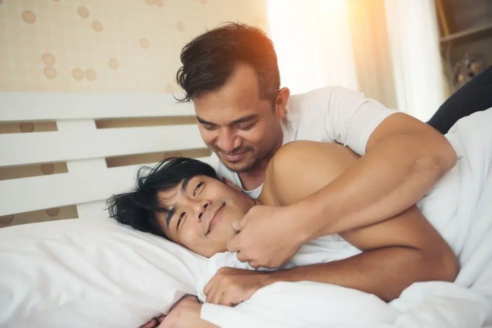gay asian couple in bed