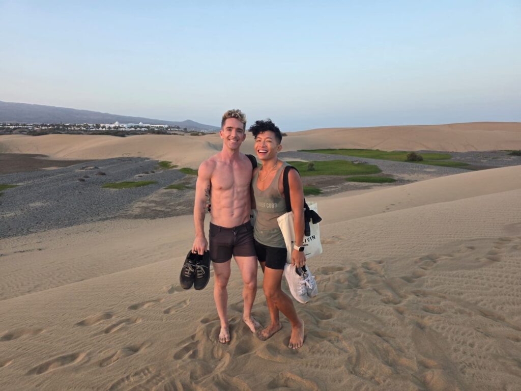 Mark and Beatus standing together in the Maspalomas dunes at dusk.