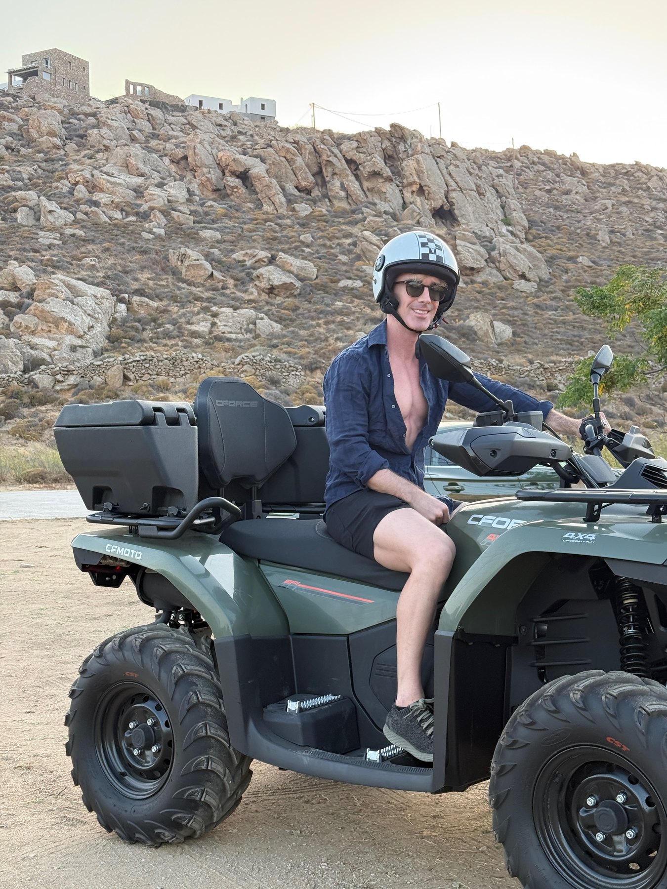 Beatus sitting on our parked rental ATV in Mykonos.