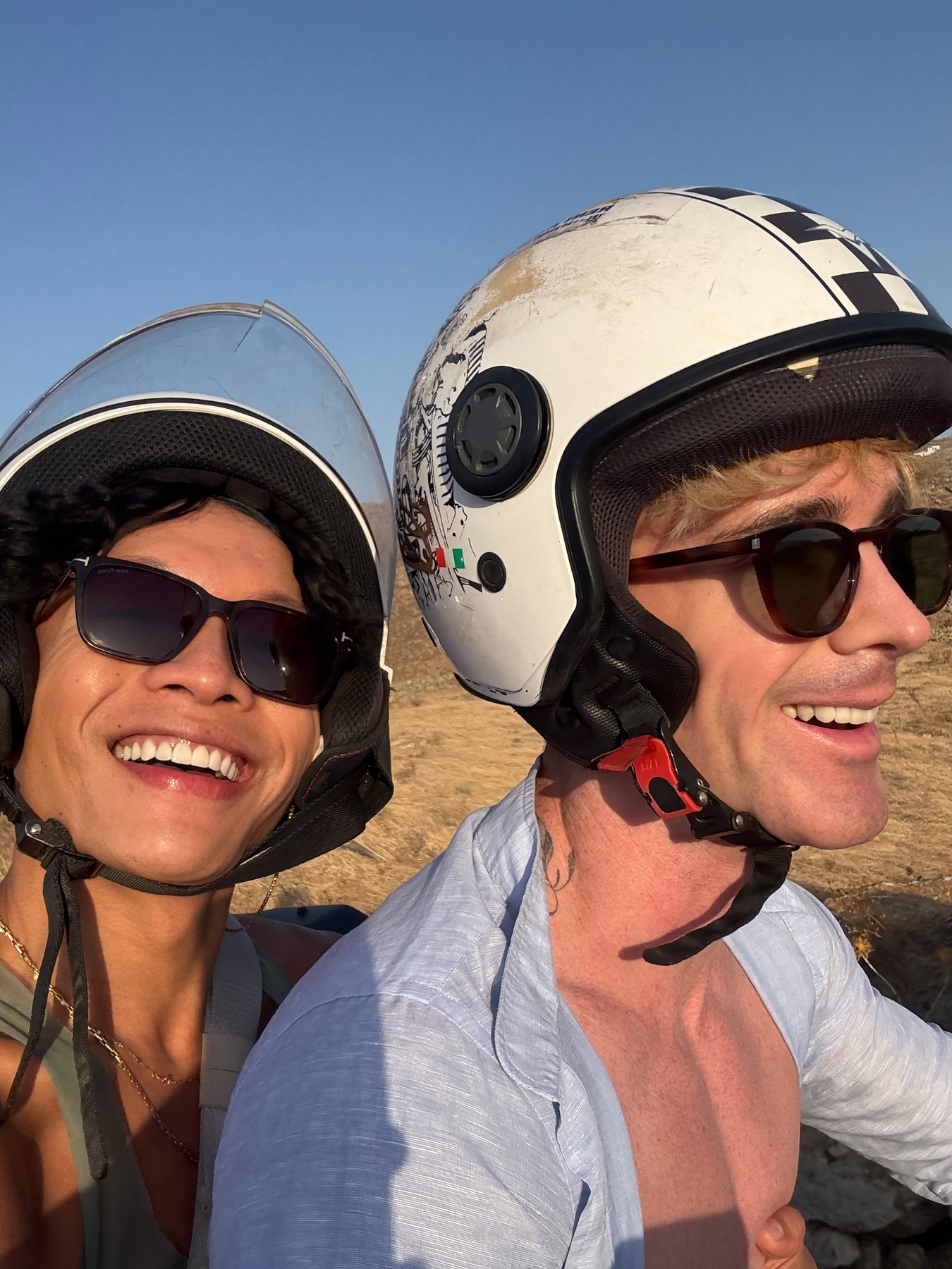 Mark and Beatus wearing helmets for an ATV ride in Mykonos.