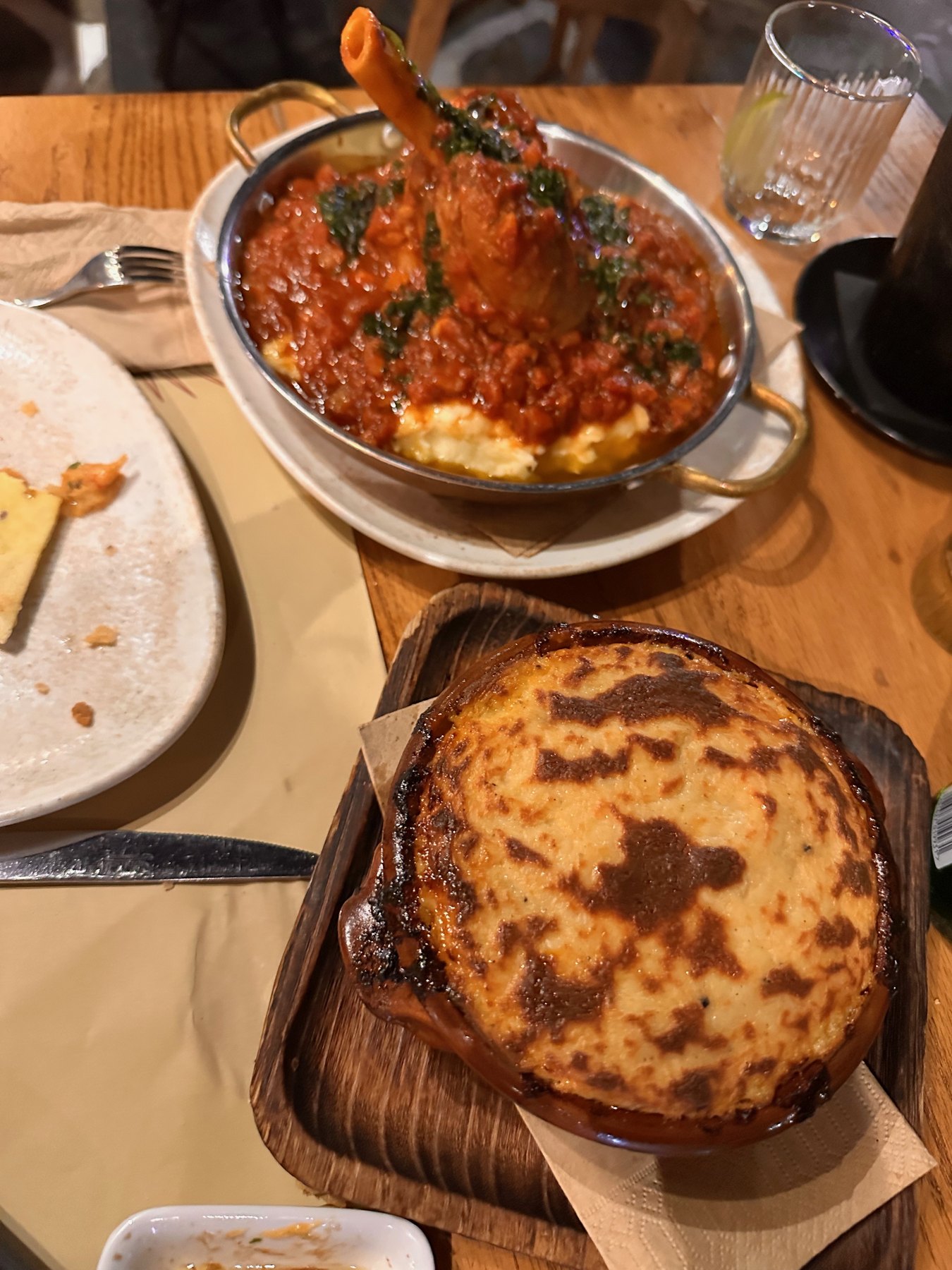 Moussaka and lamb shank on our waterfront table at Pelican Restaurant.