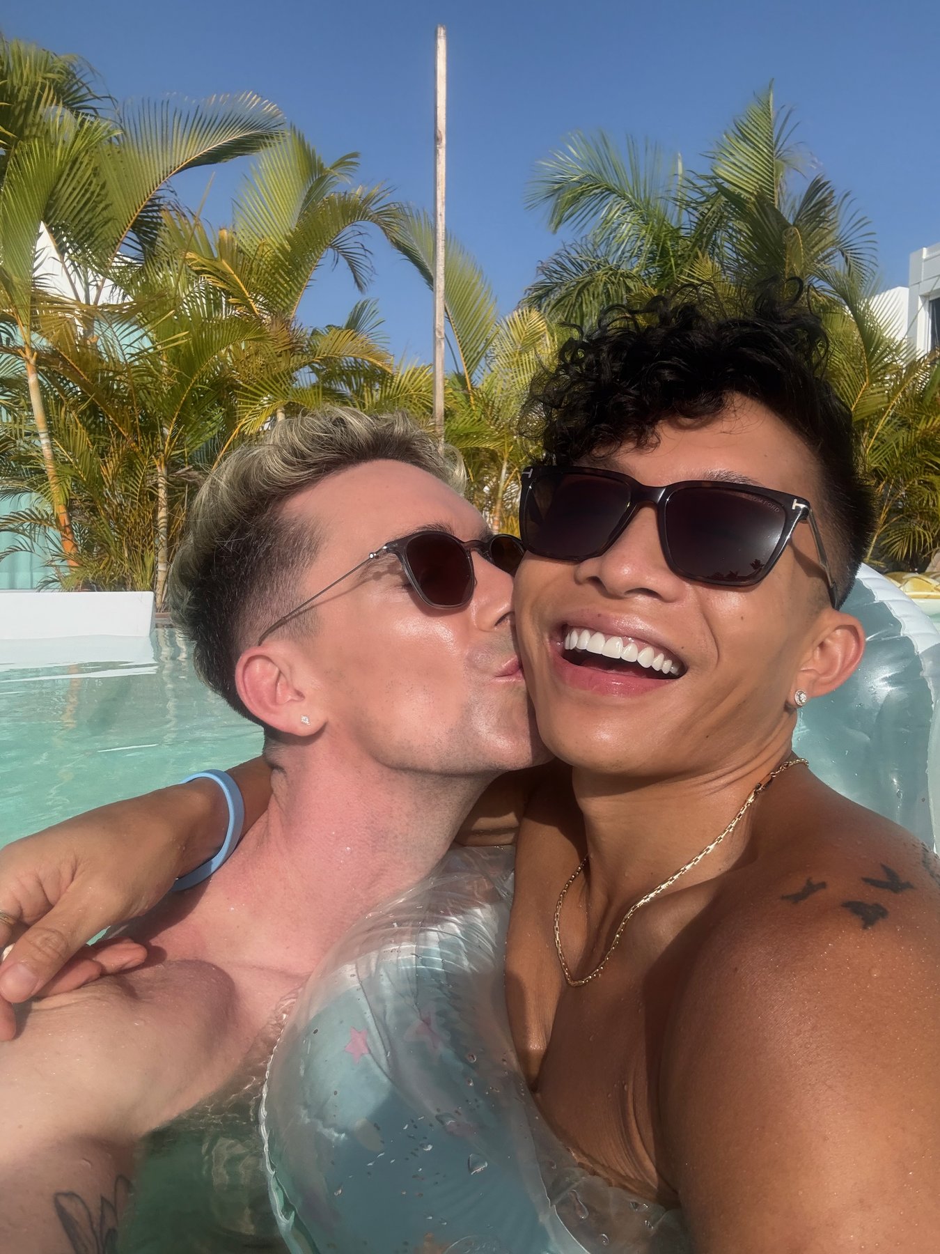 Mark and Beatus sharing a kiss in the pool at Seven Hotel & Wellness.